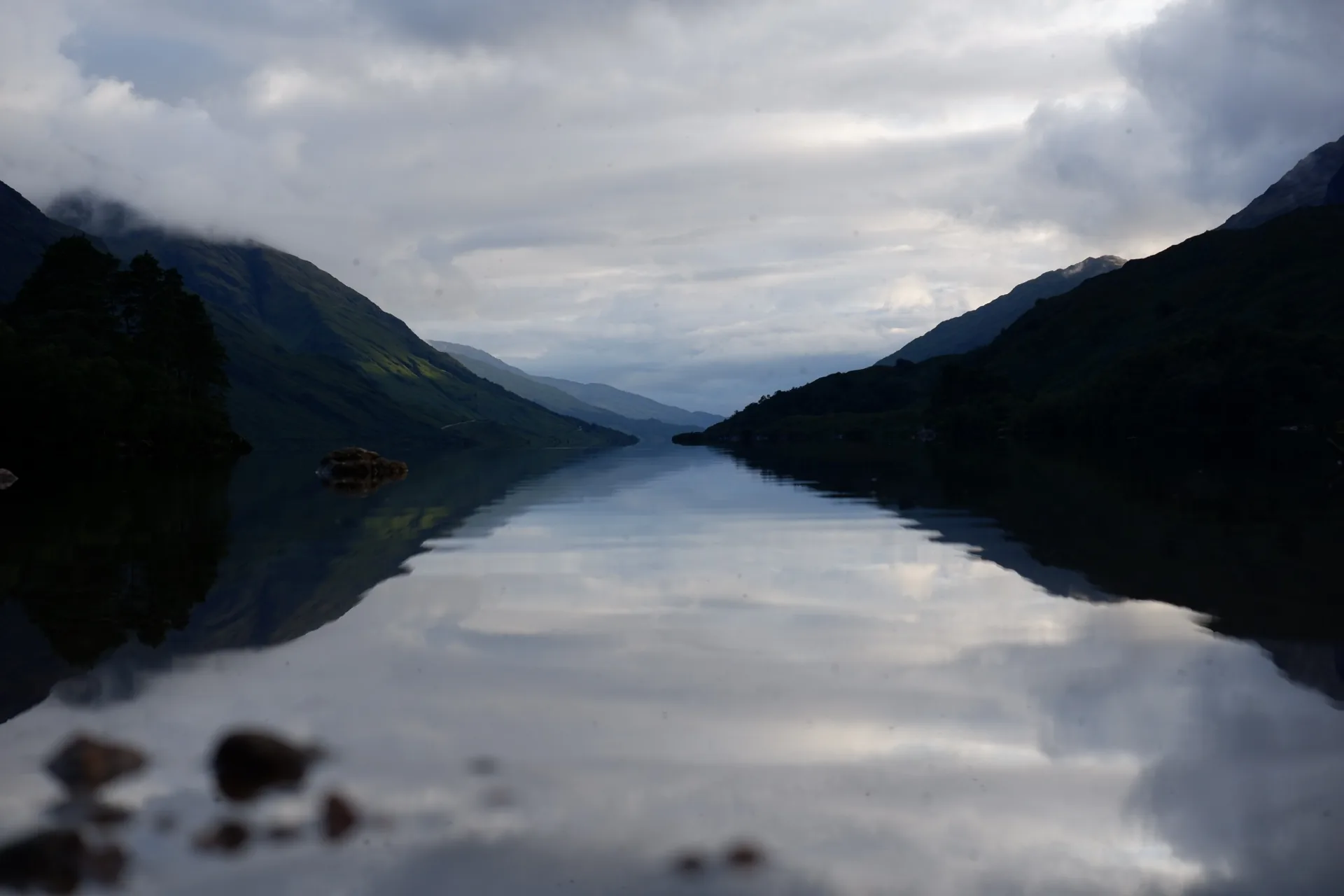 Mountains reflected in a calm loch